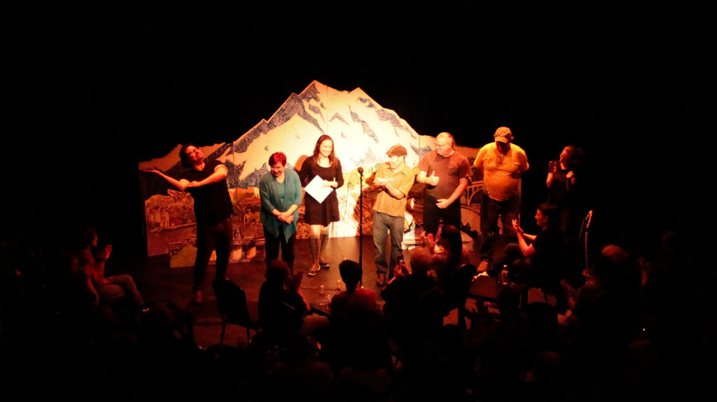 The Tad-O-Meter Audience Applause Scale was at maximum elbow tilt for Story Slam winner, Ayme Art-Bergamot